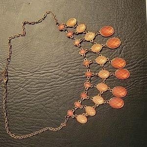 Vintage and vibrant bib necklace in peach, and amber tones